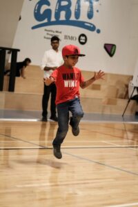 Child in gymnasium jumping